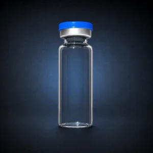 Empty transparent 10 mL sterile glass vial with a blue cap on a dark navy background