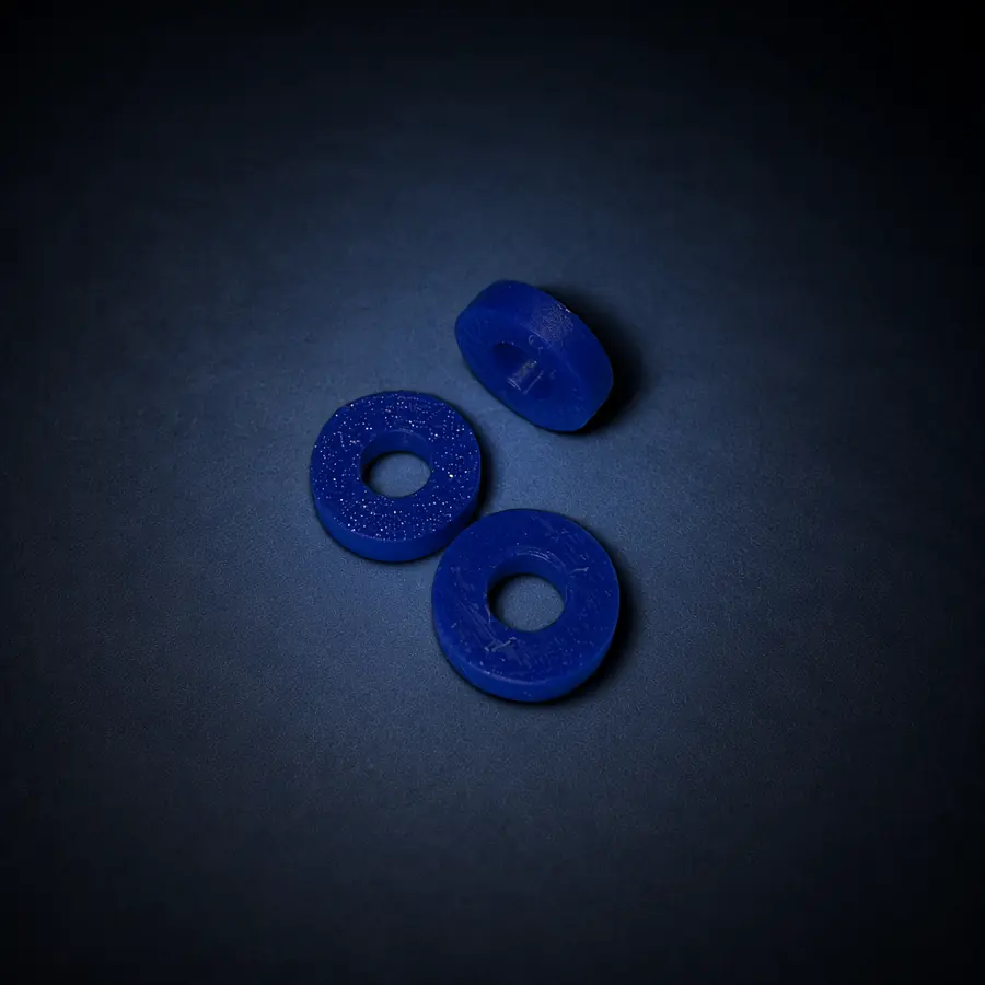 Pen Spacer Washer for 3 mL Cartridges 1 Three blue pen spacer washers on a dark navy background